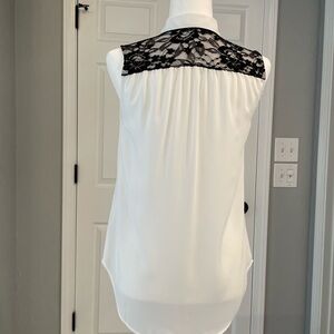 Sleeveless White Button-Up Blouse w/Black Lace on upper back.